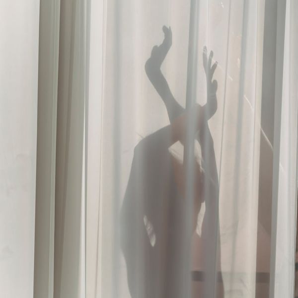 Abstract silhouette of a woman in a graceful pose, suggesting harmony.